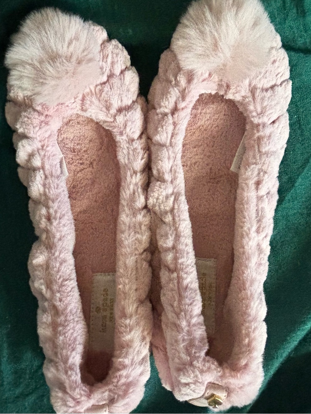 Pink Kate Spade pom pom slippers.